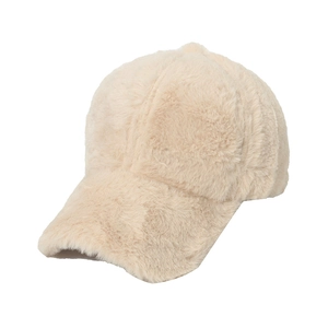 Close-up of thick cream faux rabbit fur texture on a six-panel winter baseball cap