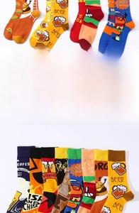 Macro detail of high cotton crew socks featuring vibrant burger and beer motifs