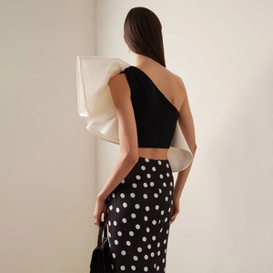 Elegant black one-shoulder swimsuit set with 3D white ruffles and polka dot wrap skirt