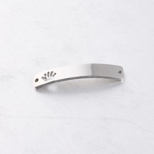 Detail of silver crown hollow curved metal connector with shiny mirror polished finish