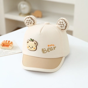 Close-up of baby bear baseball cap with plush ears and embroidered patch detail