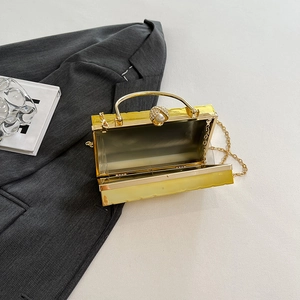 Yellow acrylic evening clutch bag with pearl rhinestone clasp and metal chain strap