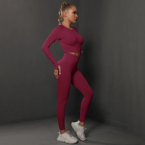 Women's burgundy seamless yoga set with long sleeve crop top and high waist leggings