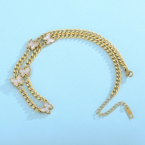 Detail of gold Cuban link chain necklace with five white mother of pearl butterfly charms
