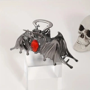 Gothic bat hair claw clip in gunmetal gray with a large red ruby gemstone inlay