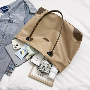 Large khaki nylon tote bag for women showing spacious interior with daily essentials