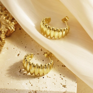 Elegant gold titanium steel C-shape wave earrings with textured hammered finish for women