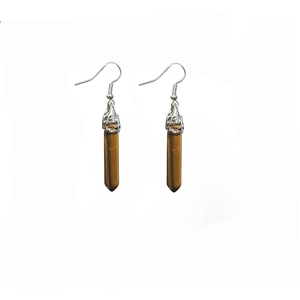 Macro view of tiger eye stone hexagonal column earrings with silver hooks
