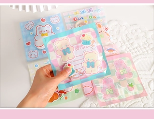 Detail of cute cartoon bear and rabbit snack bags with pastel colors and list design