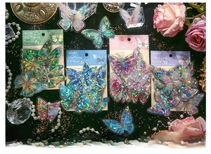 Macro detail of Mr. Paper butterfly PET laser stickers in shimmering iridescent colors