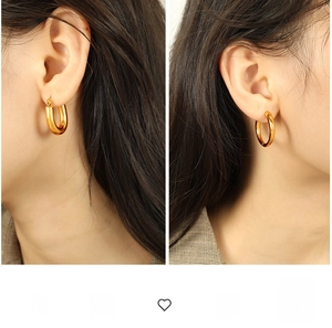 Comparison view of thick U-shaped and classic round gold hoop earrings worn by a model