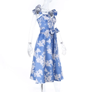 Detail of blue floral dress with satin sheen, showing side view and waist tie belt