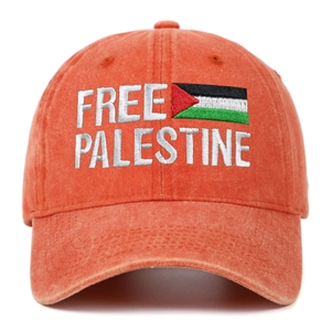 Detailed view of Free Palestine embroidery on vintage washed orange cotton baseball cap