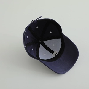 Inside view of navy blue cotton baseball cap showing internal seams and metal buckle