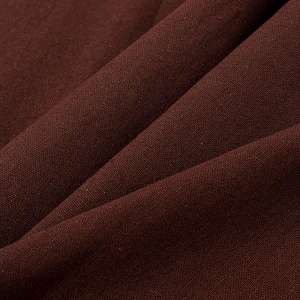 Vue macro d'un textile tissé marron foncé avec une structure de lin détaillée