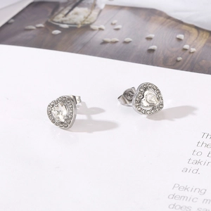 Polished silver heart-shaped zircon stud earrings with 18k gold plating details