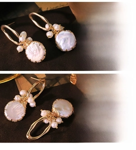 Macro detail of natural baroque pearls with gold wire wrap and vintage metal ring hooks