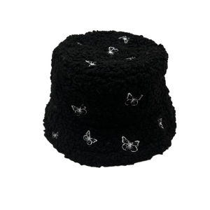 Women's black teddy fleece bucket hat with white butterfly embroidery for winter