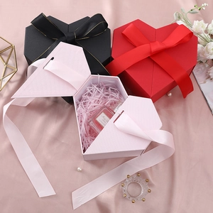 Elegant heart-shaped gift boxes in red, pink, and black with double-door design and silk bows