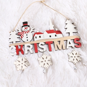 Hanging wooden Christmas sign with snowman, tree and house on white plush background