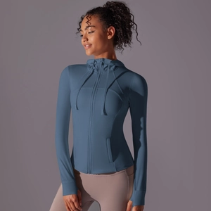 Detail of hooded sun protection jacket with slim fit design and thumbhole cuffs