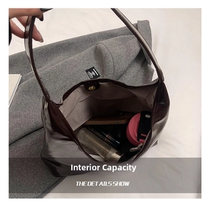 Macro detail of spacious interior with magnetic closure and smooth shiny leather texture