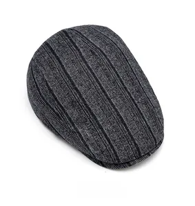 Top view of vintage flat cap featuring black and gray pinstripe woven fabric texture