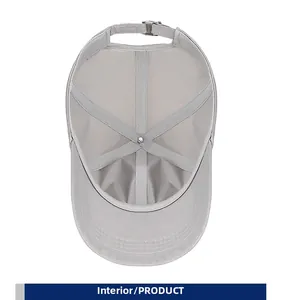 Detailed interior of a light grey baseball cap featuring smooth seams and adjustable buckle