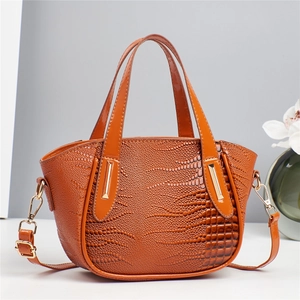 Brown faux crocodile leather crossbody bag with elegant gold hardware for autumn