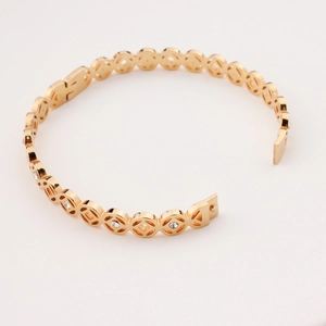 Gold hollow geometric coin bracelet with zircon accents made of stainless steel