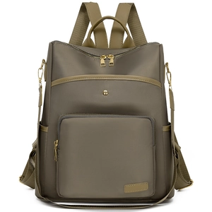 Front view of olive green soft texture backpack with multiple pockets and gold zippers