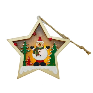 Macro view of a wooden star-shaped LED Christmas ornament with snowman and trees