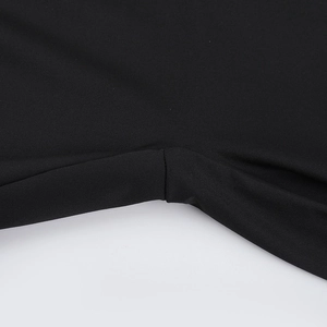 Macro shot of durable seams and black knitted fabric texture on the sleek jumpsuit