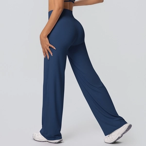Rear view of navy blue high-waisted wide-leg yoga pants showing slimming fit and curves