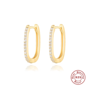 Detail view of gold S925 sterling silver oval hoop earrings with small zircon stones