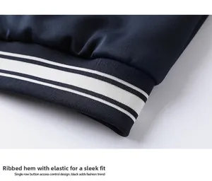 Detail of ribbed hem with white stripes on a heavy knit navy blue sports jacket