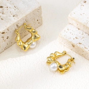 French vintage irregular molten gold earrings with white pearls on a stone base