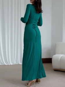 Detail of dark green dress showing back lace-up design and elegant slim fit silhouette