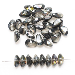 Close-up of 8x17mm dark rainbow glass beads with iridescent finish for DIY jewelry
