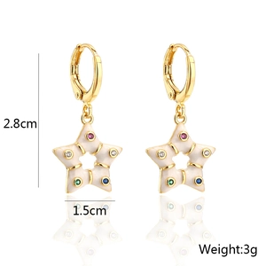 Detail shot of bohemian 18K gold-plated earrings with colorful zircon star pendants