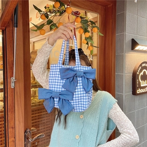 Blue gingham canvas lunch bag featuring large denim bows and matching top handles