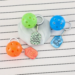 Three-piece set of zinc alloy pickleball paddle keychains in green, blue, and orange