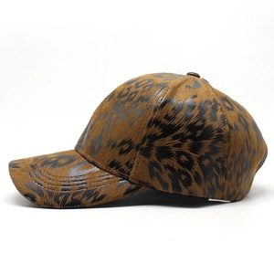 Detail of vintage leopard print baseball cap featuring textured synthetic leather and curved brim