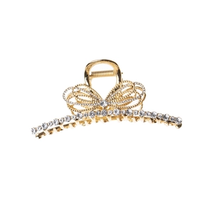 Elegant gold metal bow hair claw clip with rhinestones and hollow design on white background