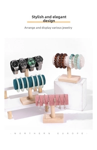 Detail of T-bar jewelry display stands with wooden bases and multi-color velvet rollers