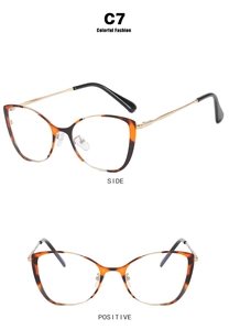 Detail view of cat eye tortoise glasses frame with golden metal arms and black tips