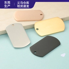 Detailed view of four matte metal dog tags in silver, rose gold, gold, and black finishes