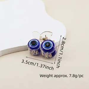 Detail shot of the evil eye hair claw clip showing dimensions 3.5cm by 2.8cm