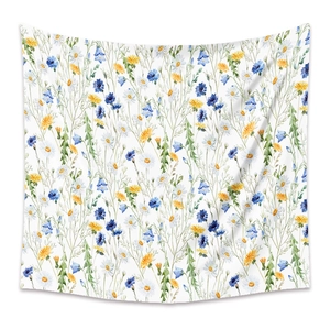 Detail of bohemian tapestry featuring watercolor floral patterns on white background