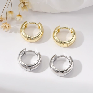 Minimalist wide copper hoop earrings in gold and silver finish with polished surface